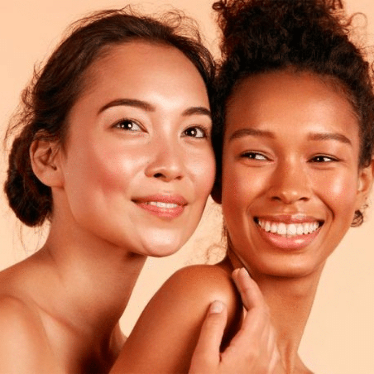 Two smiling women with amazing skin